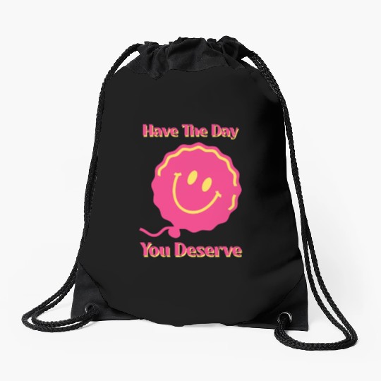 Have The Day You Deserve, pink smile face, balloon Drawstring Bags