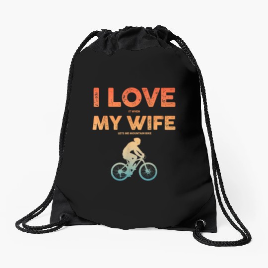 i love it when my wife lets me mountain bike Drawstring Bags