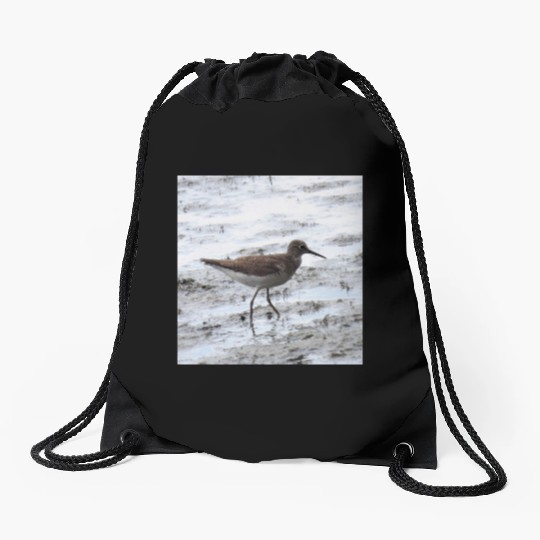 Sandpiper walking along the shore Drawstring Bags