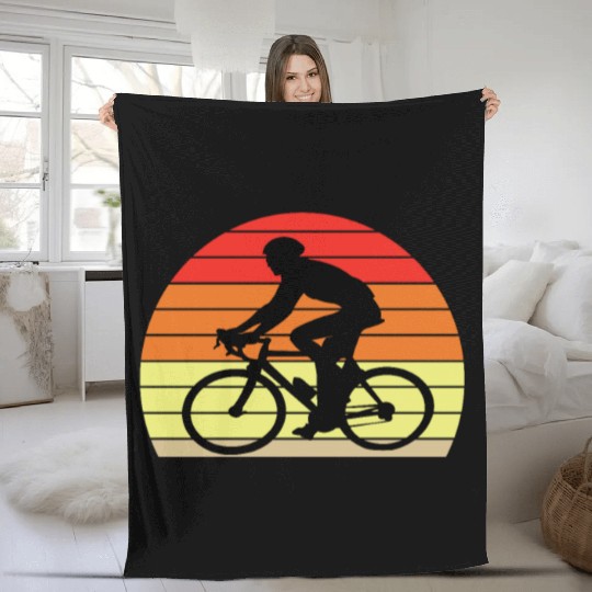 Retro sunset male cyclist Fleece Blankets