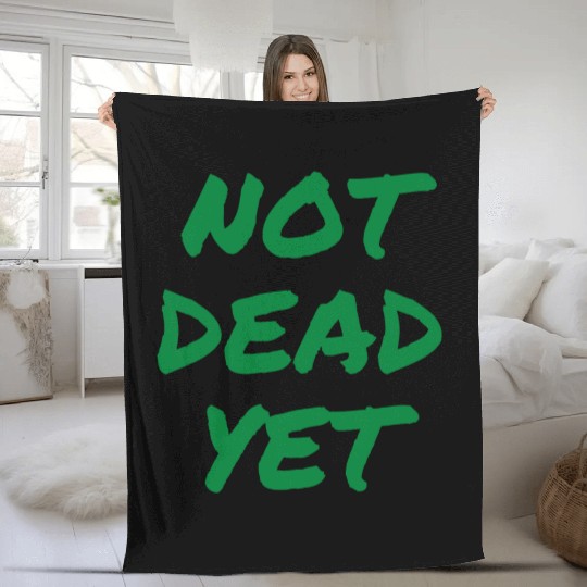 NOT DEAD YET (in green graffiti letters) Fleece Blankets