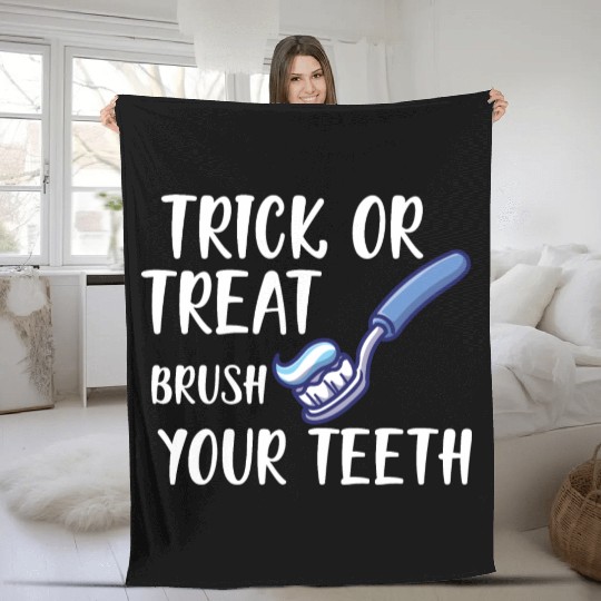Trick or treat brush your teeth Fleece Blankets