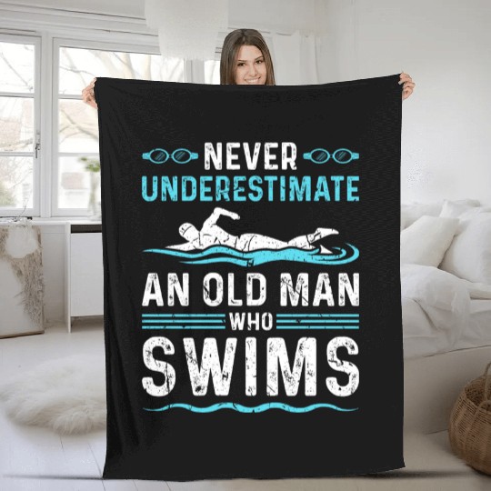 Never Underestimate Man Swim Fleece Blankets