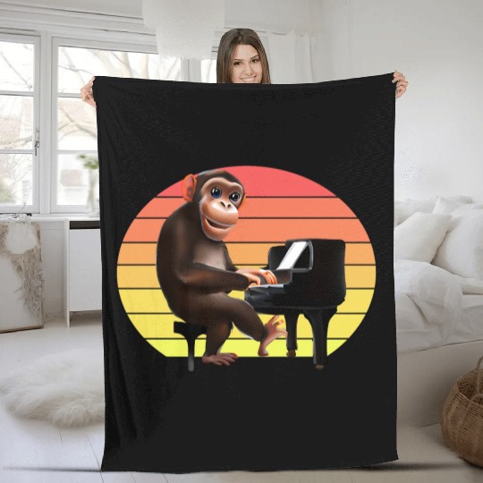 Monkey at the piano Fleece Blankets