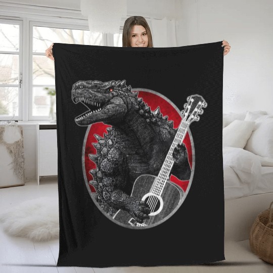 Kaiju playing guitar Fleece Blankets