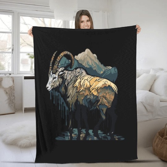 a mountain goat lives in the mountains Fleece Blankets