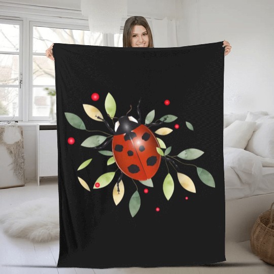 red glowing ladybug with green leaves Fleece Blankets