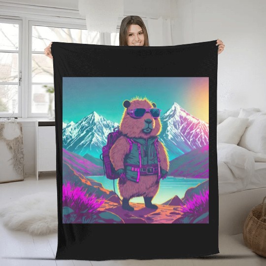 Capybara hiking thru the Mountains Fleece Blankets
