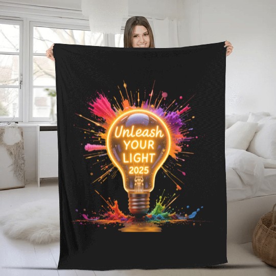 A large starburst glowing in neon light with 2025 Fleece Blankets