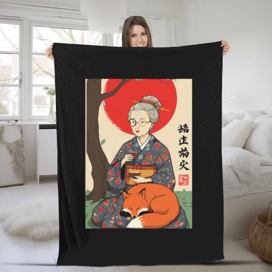 Older japanese mom sippin tea sitting with red fox Fleece Blankets