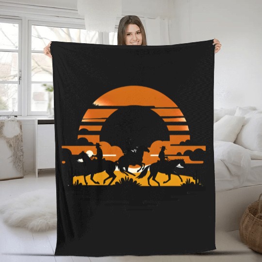 Western Riders at Sunset Fleece Blankets