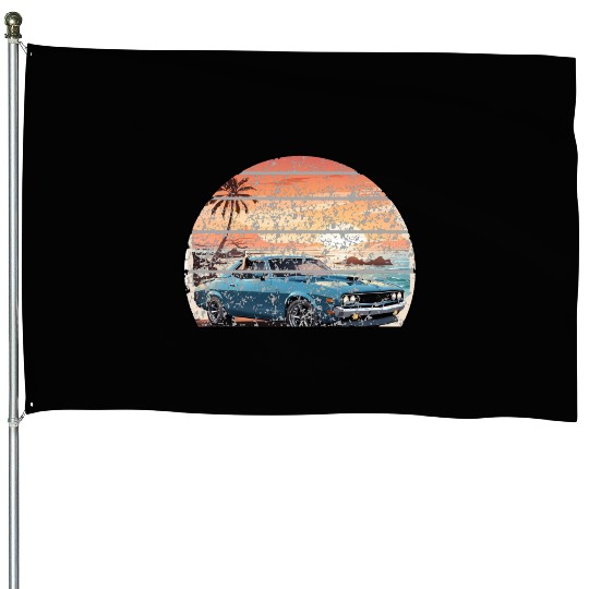 A muscle car cruisingon a coastal road. House Flags