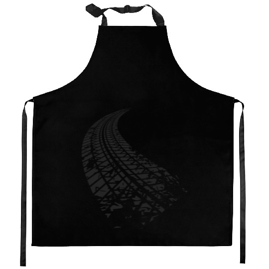 Dirty tire tracks fading into the horizon Kitchen Aprons