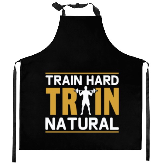 Train hard train natural Kitchen Aprons
