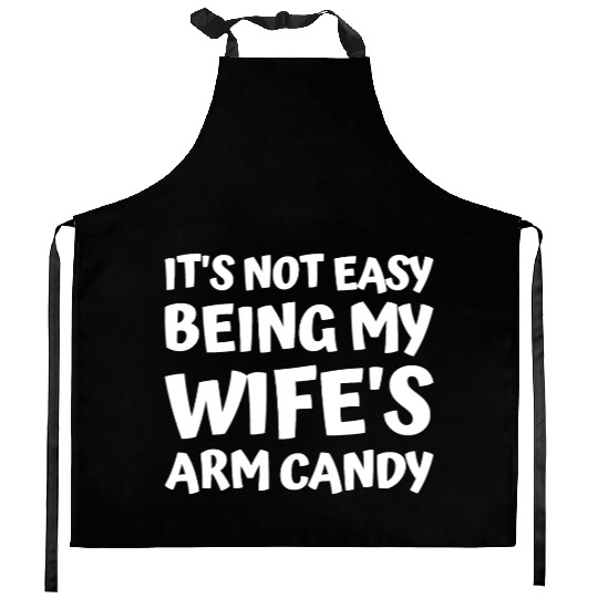 its not easy being my wifes arm candy fathers day Kitchen Aprons