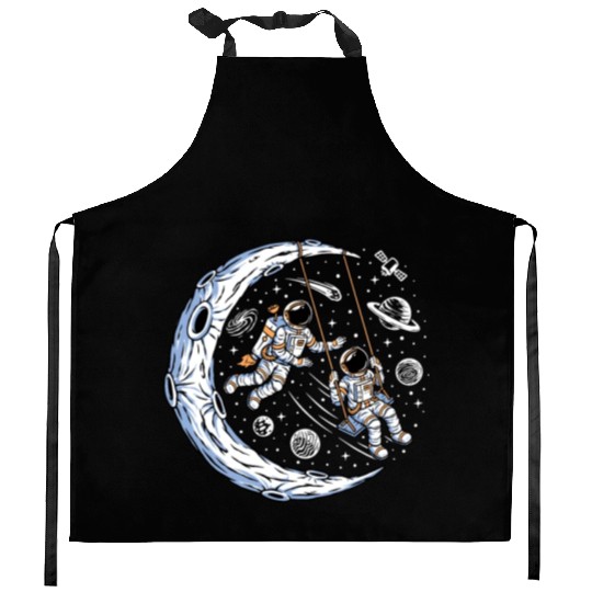 Astronauts on swing on moon Kitchen Aprons