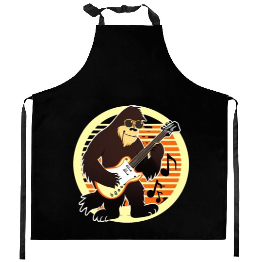 Funny Bigfoot playing a guitar Kitchen Aprons
