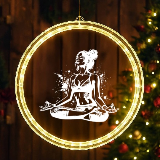 Yoga Teacher Doing Relaxation Exercises For The LED Christmas Window Lights