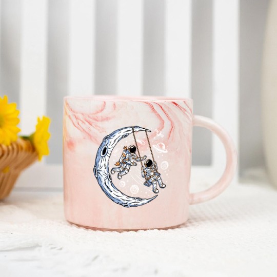Astronauts on swing on moon Marble Mugs