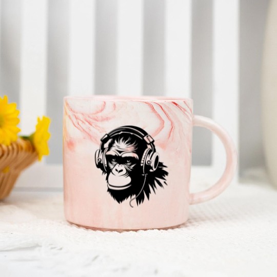 A gorilla wearing a headphone listening to music Marble Mugs