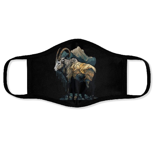 a mountain goat lives in the mountains Face Masks