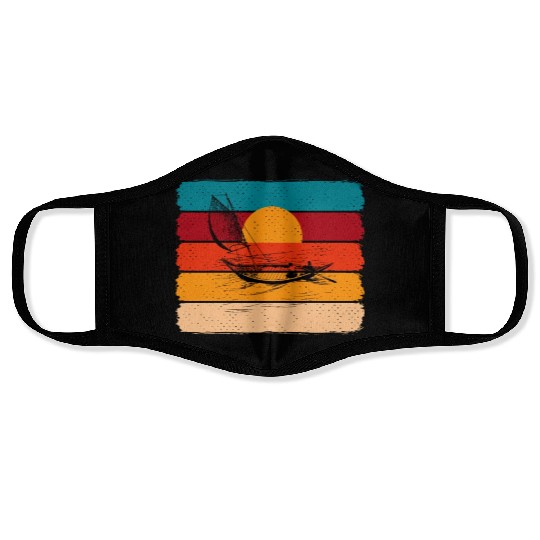 sunset with boat Face Masks