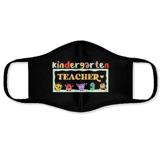 FUNNY KINDERGARTEN TEACHER Face Masks
