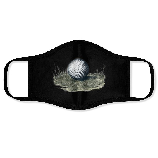 Golf ball on grass Face Masks