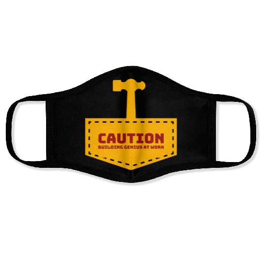 Caution building genius at work Face Masks