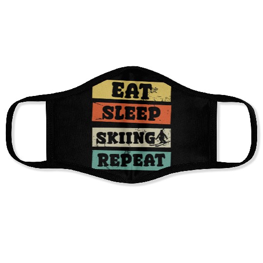 eat sleep skiing repeat Face Masks