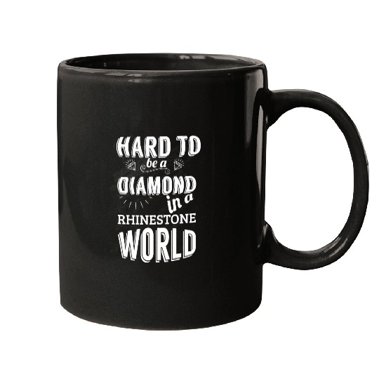 Hard to be a diamond in a rhinestone world Mugs