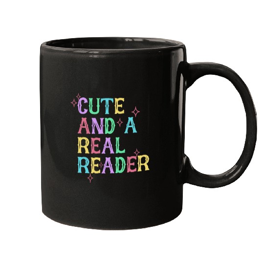 CUTE AND A REAL READER Mugs