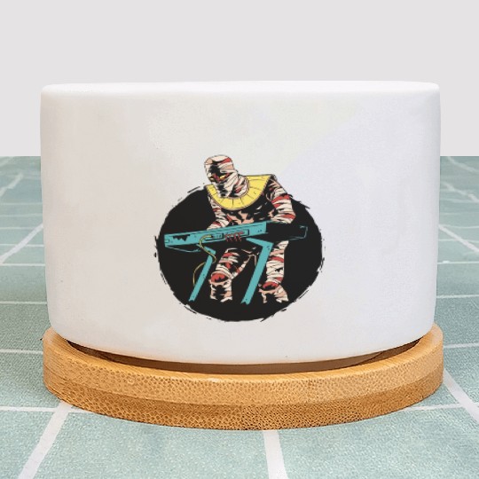 Mummy playing keyboards Mummy playing keyboards in Plant Pots