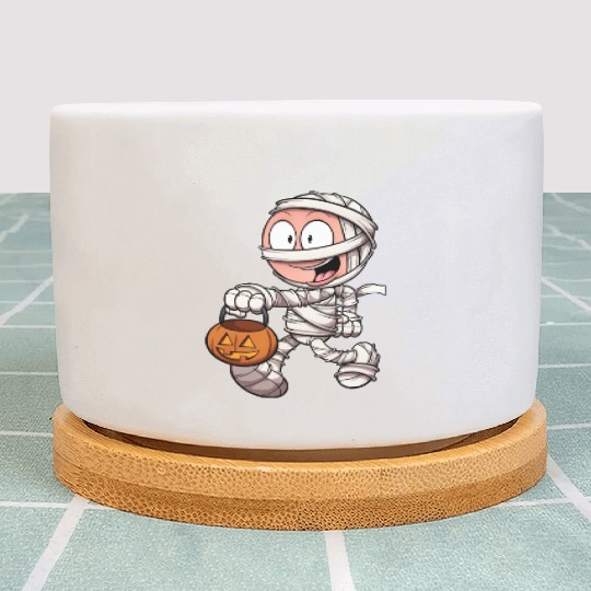 Kid In Mummy Costume Trick Or Treating Plant Pots