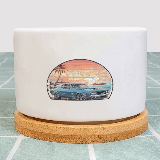 A muscle car cruisingon a coastal road. Plant Pots