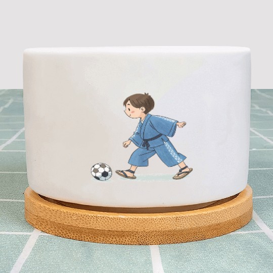 Boy in kimono playing soccer Plant Pots