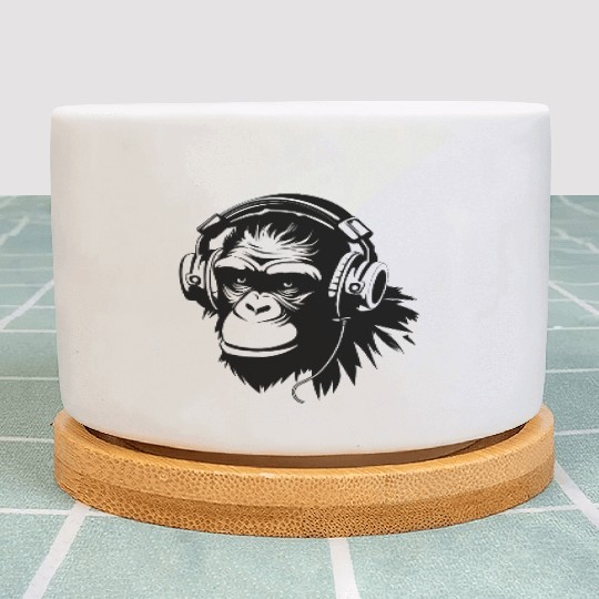 A gorilla wearing a headphone listening to music Plant Pots
