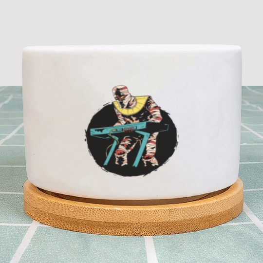 Mummy playing keyboards Mummy playing keyboards in Plant Pots