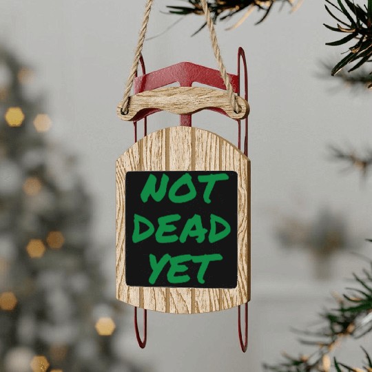 NOT DEAD YET (in green graffiti letters) Sled Ornaments