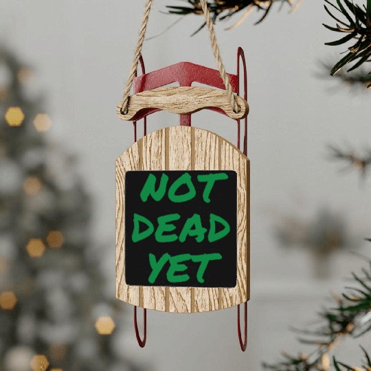 NOT DEAD YET (in green graffiti letters) Sled Ornaments