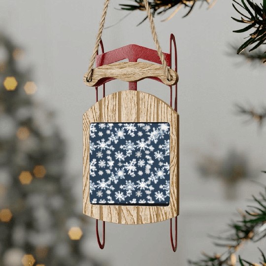 Snow pattern on navy blue background Sled Ornaments
