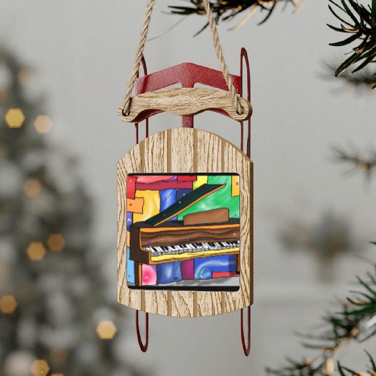 A beautiful piano in front of a colorful art Sled Ornaments