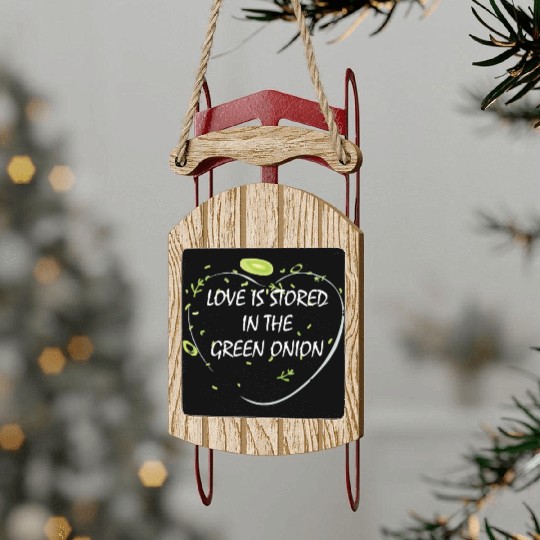 Love is stored in the green onion Sled Ornaments