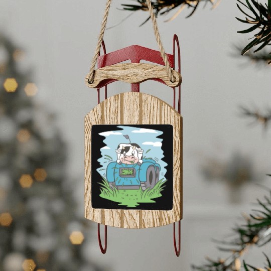 Cow eating grass tractor Cow eating grass tractor Sled Ornaments