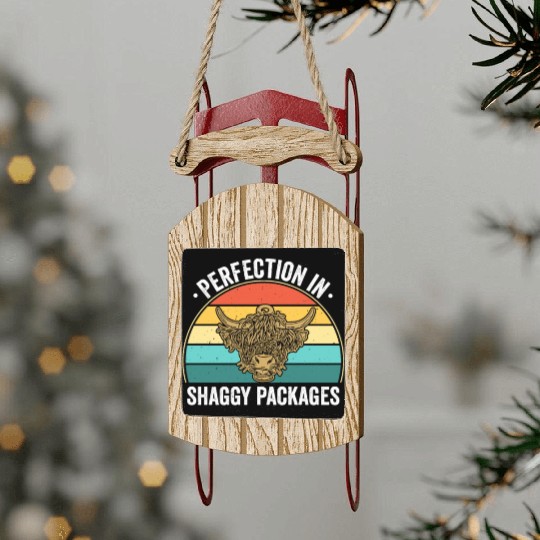 Perfection In Shaggy Packages Highland Cow Sled Ornaments