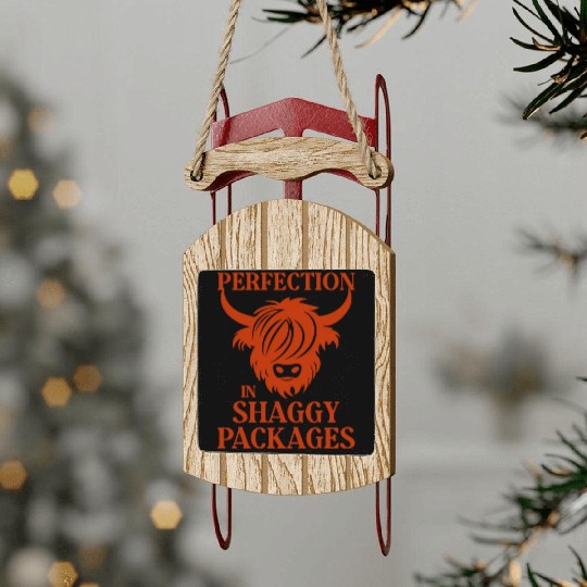 Perfection In Shaggy Packages Highland Cow Sled Ornaments