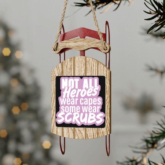 Not all heroes wear capes, some wear scrubs pinky Sled Ornaments