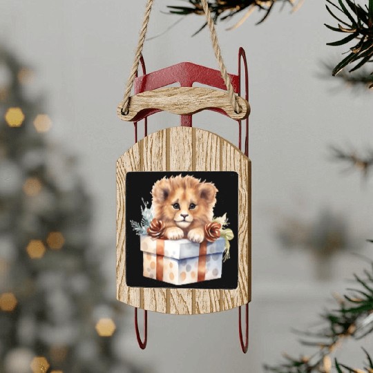 African Lion inside a Christmas gift box Sled Ornaments