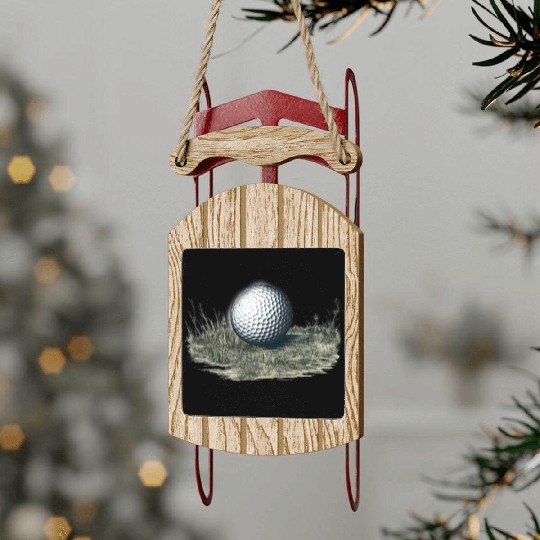 Golf ball on grass Sled Ornaments