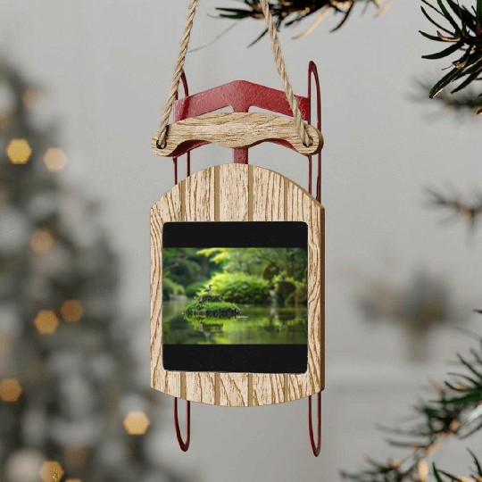 Serene Pond with Bird on Mossy Rock Sled Ornaments